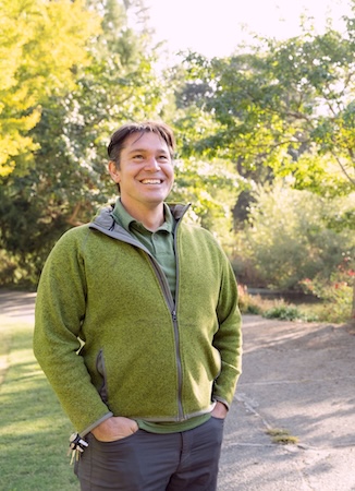 Tyler Kern smiles, posing outside