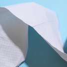 top-view of toilet paper on blue background